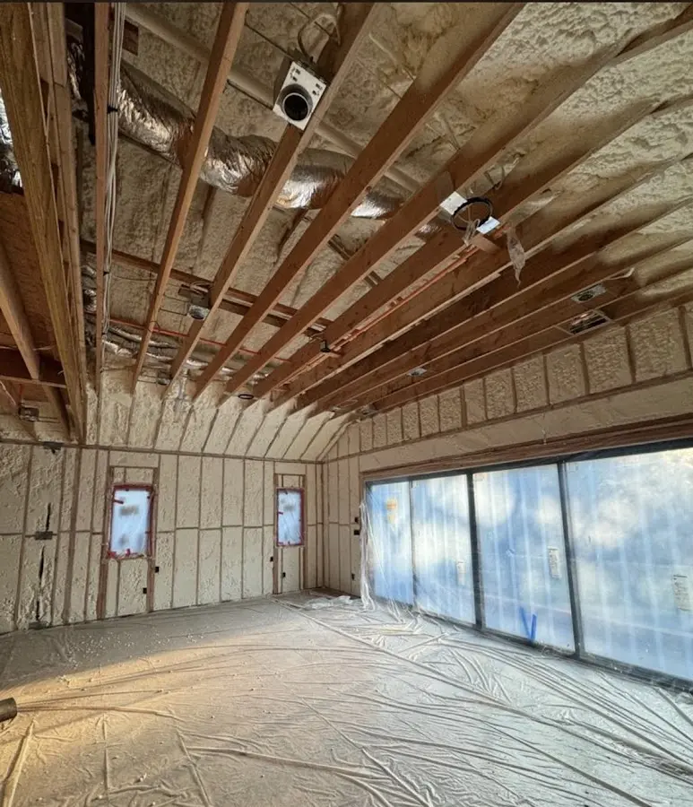 Interior walls and ceiling insulated with spray foam during new construction in Lockhart